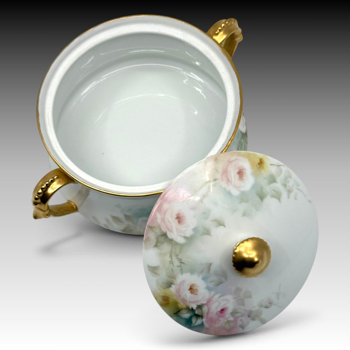 T&V Limoges biscuit jar open showing porcelain interior and decorated lid